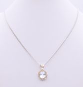 A silver pendant and chain. Pendant 1.25 cm diameter, chain 46 cm long.