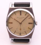 A Patek Philippe chromium plated automatic wristwatch with silvered dial with gilt baton hour