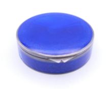 A silver and enamel powder compact. 7 cm diameter.