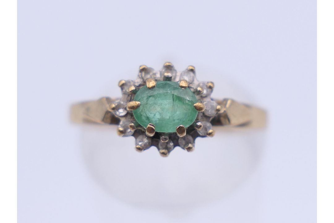 A 9 ct gold single stone emerald ring. Ring size M. 2.1 grammes total weight. - Image 1 of 6