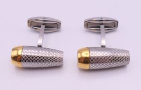 A pair of cufflinks stamped AP and Audemars Piguet. 2.25 cm long.