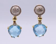A pair of dress earrings. 2.5 cm high.