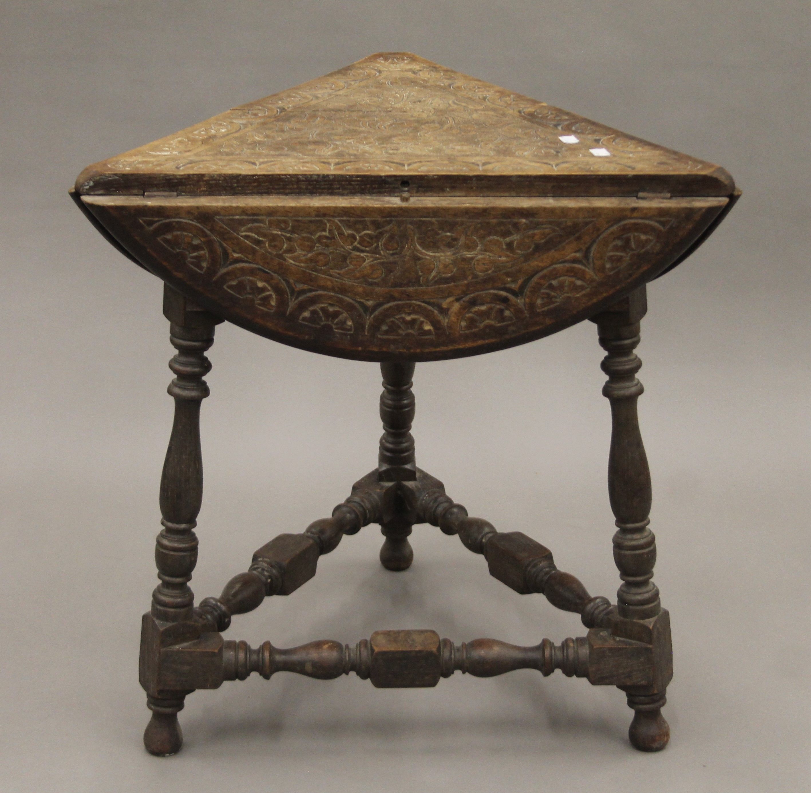 A Victorian carved oak triple drop leaf table. 59 cm wide. - Image 4 of 6