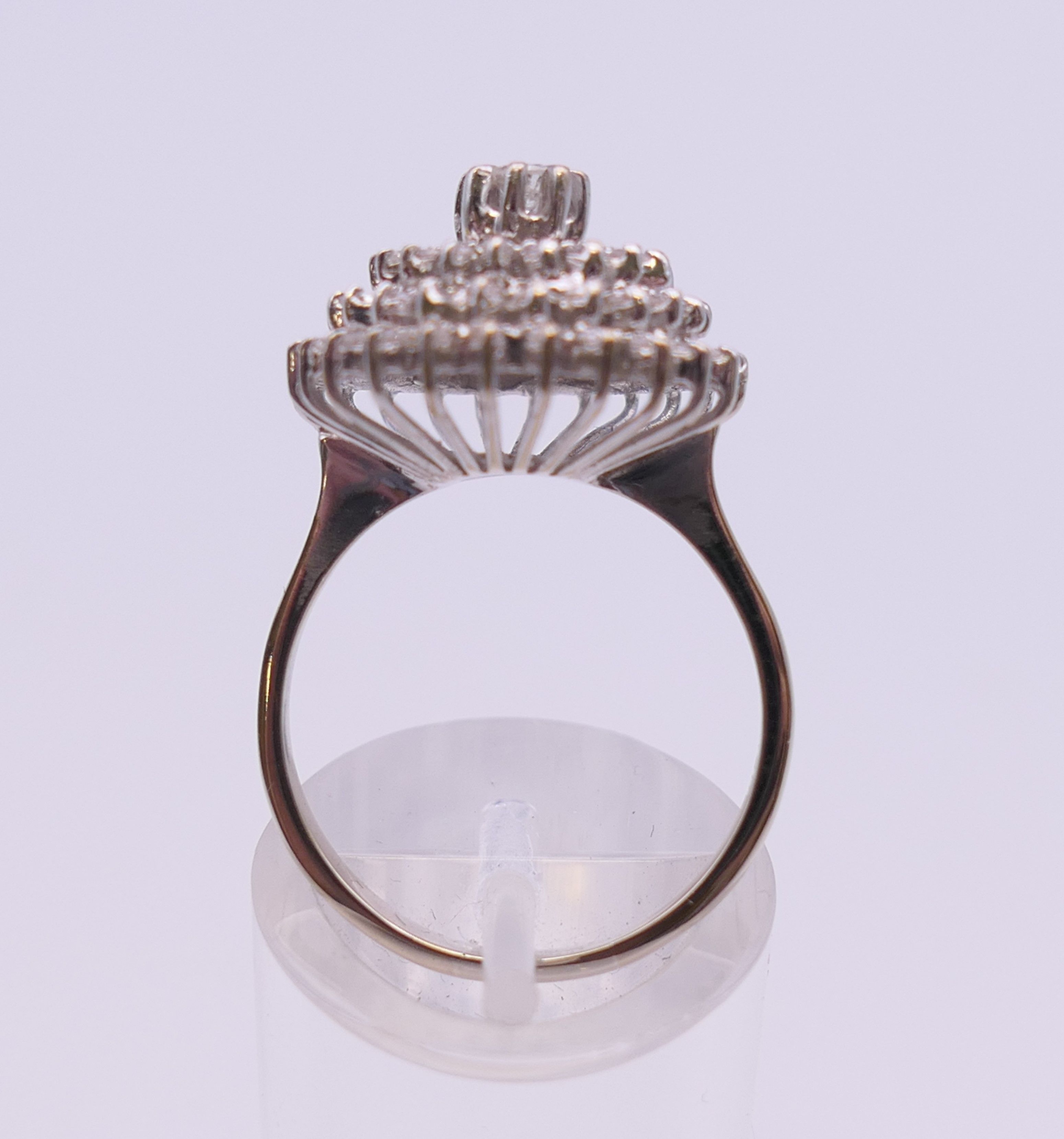 An 18 ct white gold diamond cluster ring. Ring size O. 6.3 grammes total weight. - Image 8 of 12