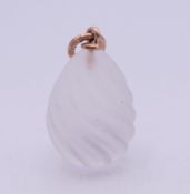 A 14 ct gold Russian rock crystal egg. 2 cm excluding suspension loop.