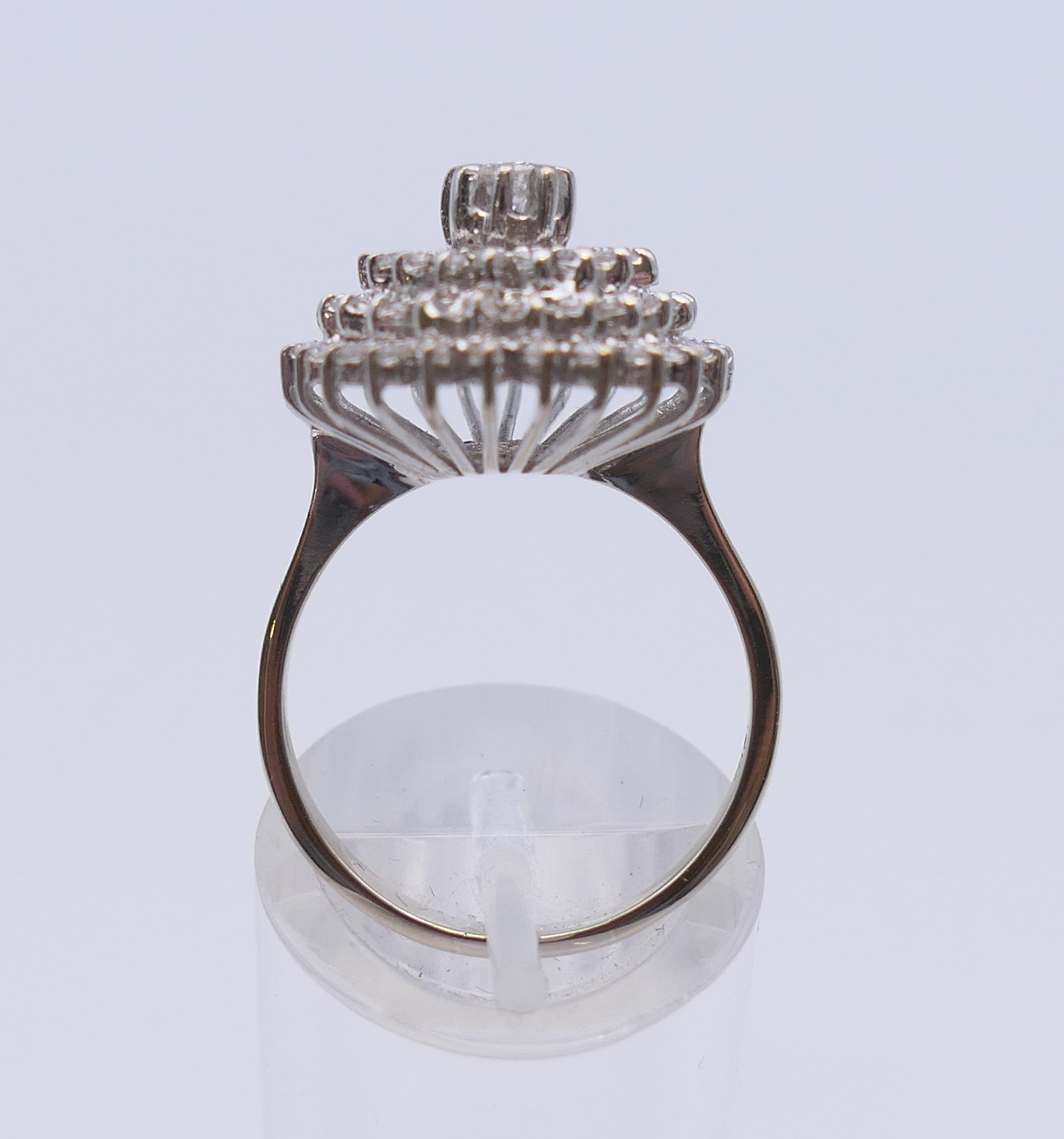 An 18 ct white gold diamond cluster ring. Ring size O. 6.3 grammes total weight. - Image 9 of 12