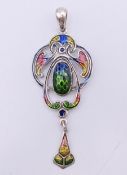A silver Art Nouveau style pendant. 5 cm high.