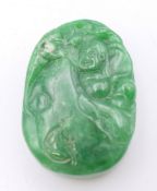 A jadite green pendant. 4.5 cm high.