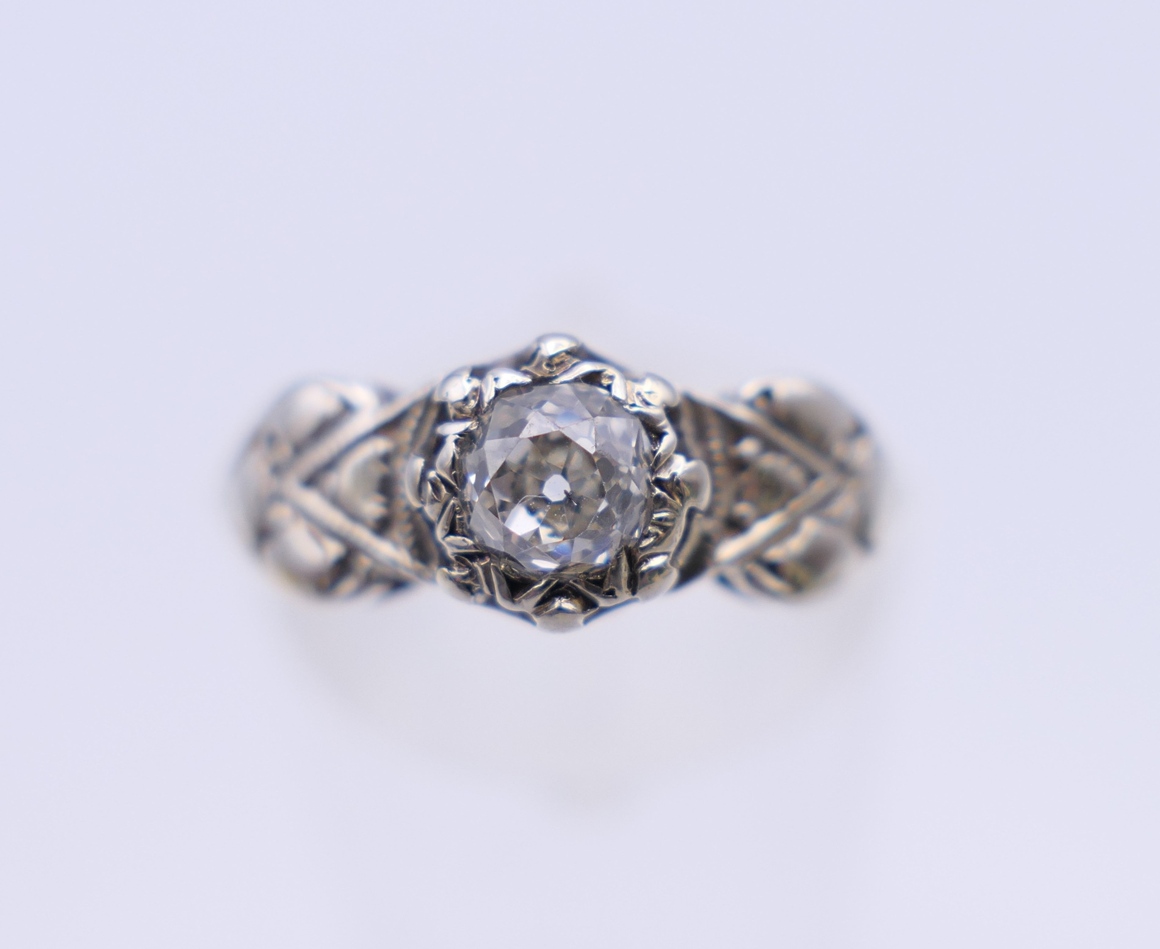 An 18 ct gold Arts and Crafts style ring. Ring size L/M. 2.6 grammes total weight.
