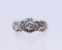 An 18 ct gold Arts and Crafts style ring. Ring size L/M. 2.6 grammes total weight.