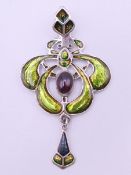 A silver Art Nouveau style pendant. 6 cm high.