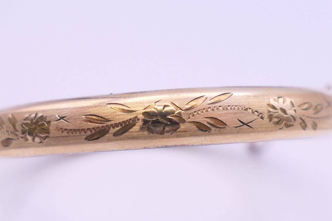 A 1/5th 9 ct rolled gold bangle form bracelet. 6.5 cm wide. 11 grammes total weight. - Image 8 of 8