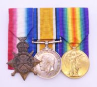A trio of WWI medals awarded to L-29354 GNR G HAIGH RA.