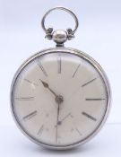 A silver cased open face pocket watch. 5 cm diameter.