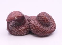 A netsuke formed as a snake. 5 cm long.