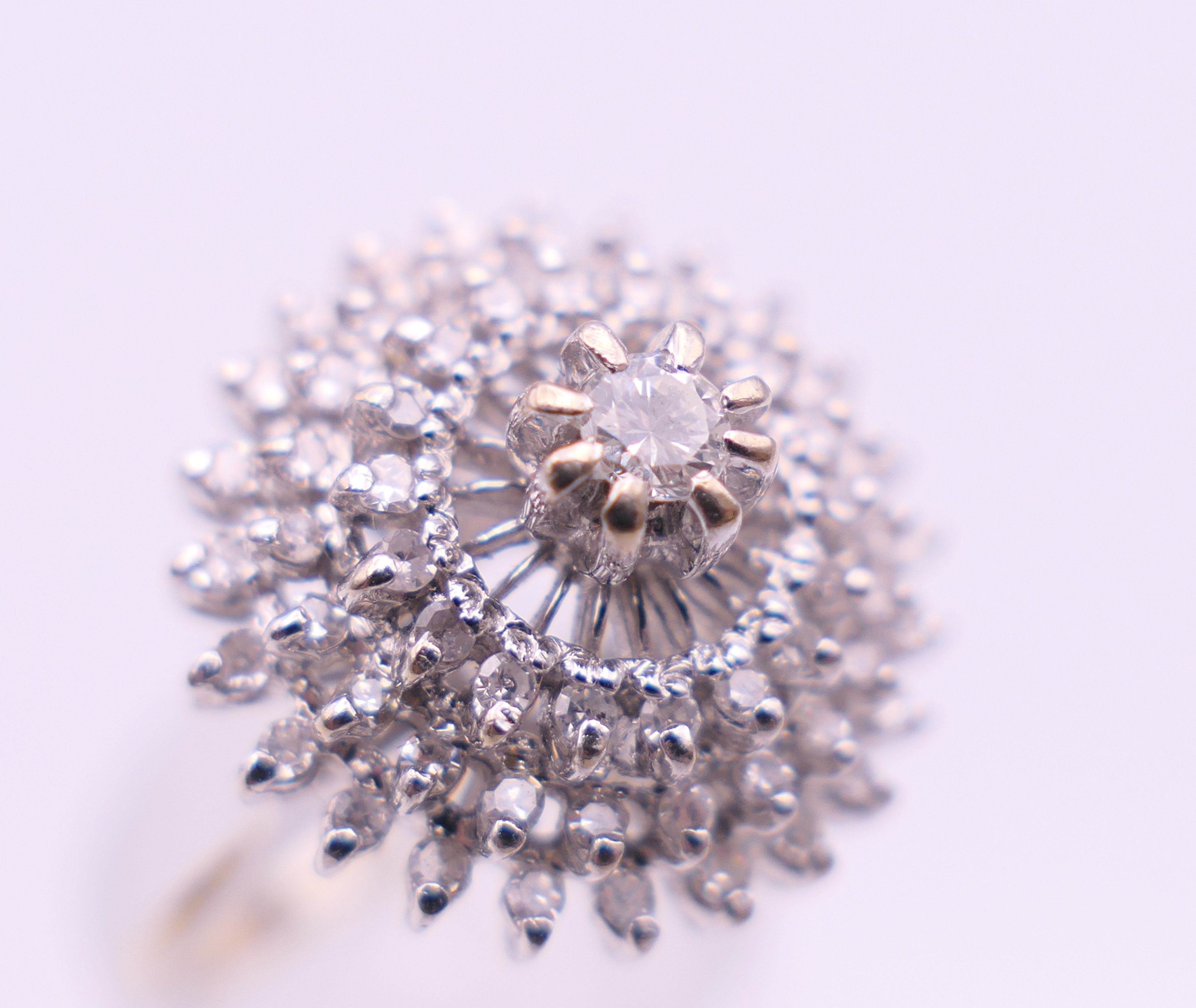 An 18 ct white gold diamond cluster ring. Ring size O. 6.3 grammes total weight. - Image 6 of 12