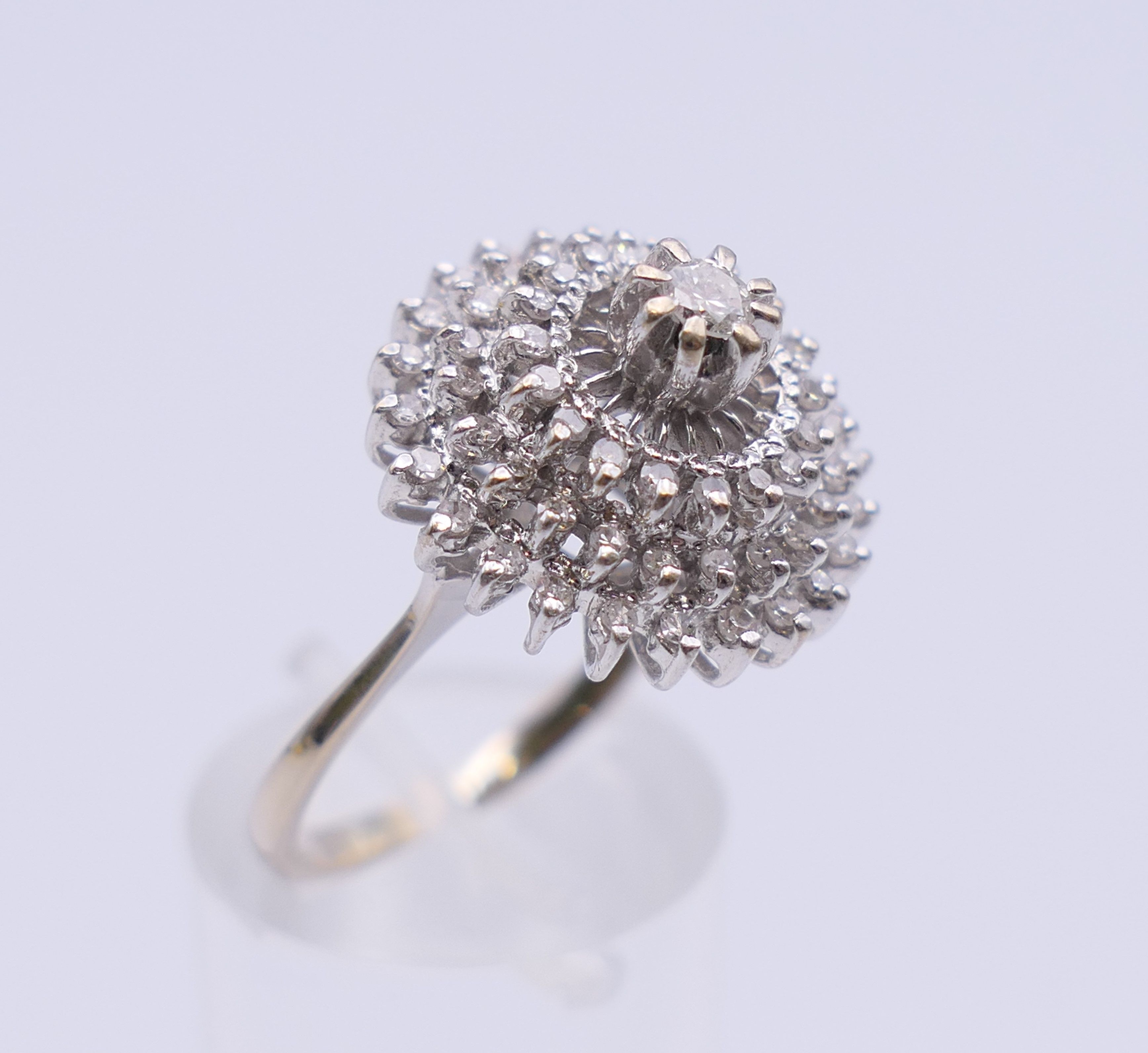 An 18 ct white gold diamond cluster ring. Ring size O. 6.3 grammes total weight. - Image 5 of 12