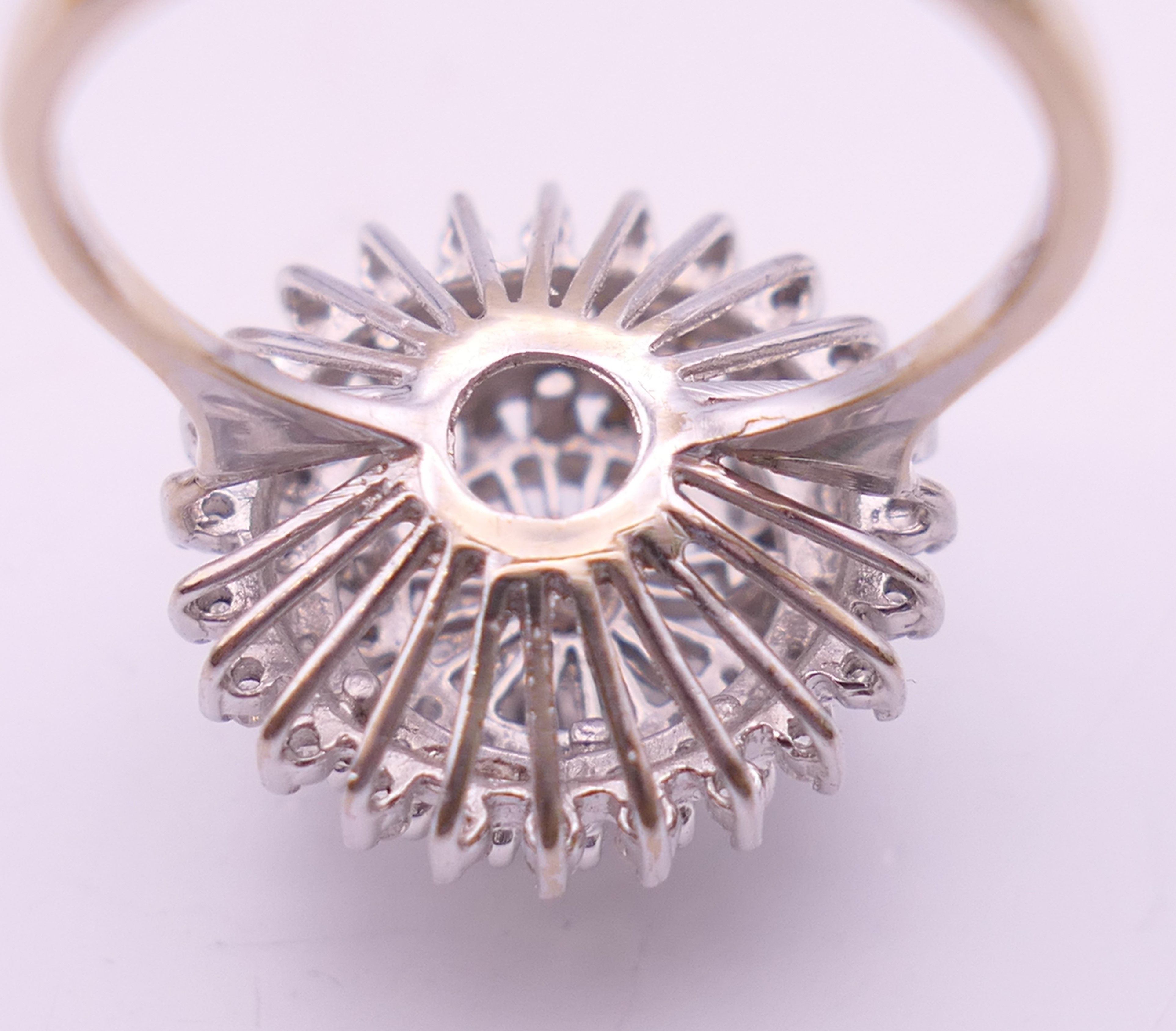 An 18 ct white gold diamond cluster ring. Ring size O. 6.3 grammes total weight. - Image 12 of 12