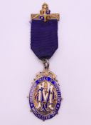 A boxed silver gilt and enamel Independent Order of Oddfellows Manchester Unity medal.