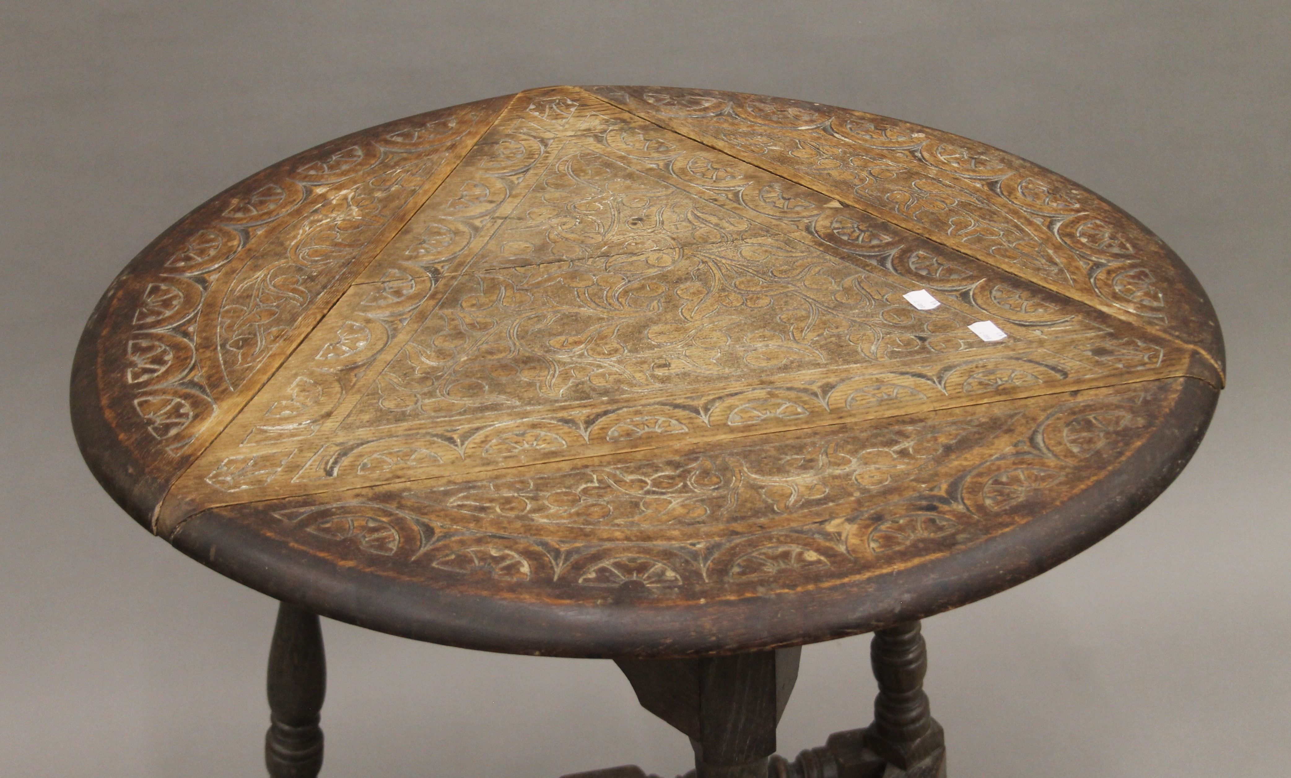 A Victorian carved oak triple drop leaf table. 59 cm wide. - Image 2 of 6
