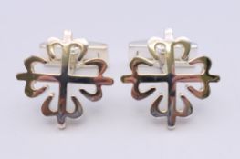 A pair of silver Patek Philipe cufflinks. 2.25 cm wide.