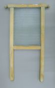 A vintage wash board. 69 cm high.