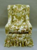 An early 20th century upholstered armchair. 73 cm wide.