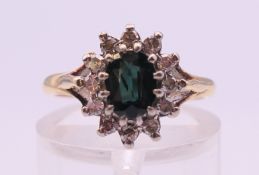 An 18 ct gold sapphire and diamond ring. Ring size I/J. 4 grammes total weight.