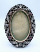 An antique rough cut diamond set photograph frame, possibly adapted from a buckle. 8.5 x 6.5 cm.