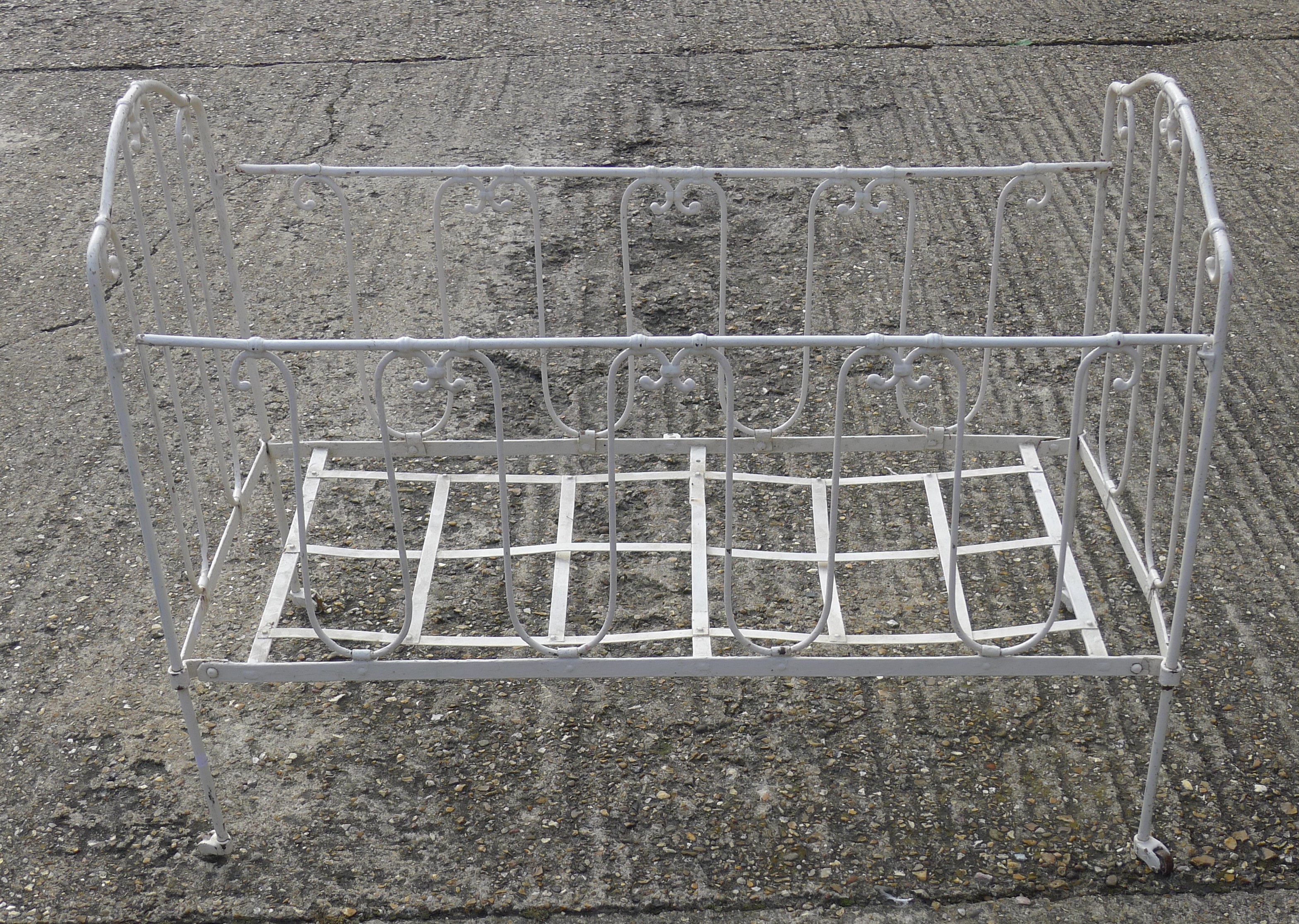 A Victorian iron folding cot. 105 cm long.