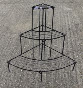 A modern corner metal plant stand. 76 cm high.