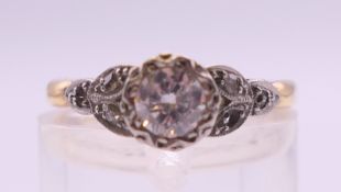 An 18 ct gold and platinum approximately 1/3 carat diamond solitaire ring. Ring size M/N. 2.