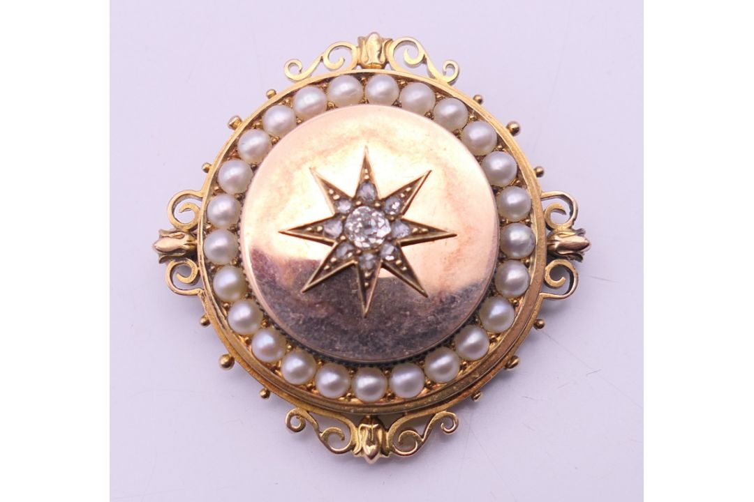 A Victorian unmarked gold seed pearl and diamond set pendant/brooch. 3.5 cm diameter. 13. - Image 1 of 6