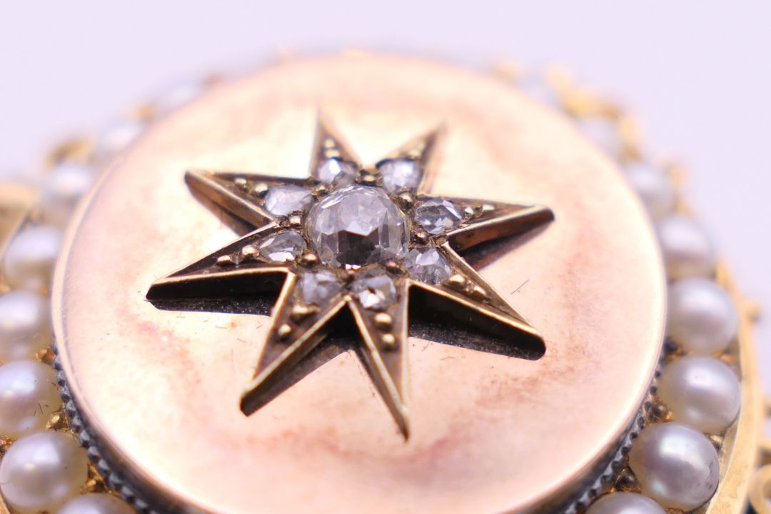 A Victorian unmarked gold seed pearl and diamond set pendant/brooch. 3.5 cm diameter. 13. - Image 6 of 6