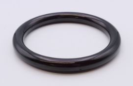 A bangle. Approximately 6.5 cm internal diameter.