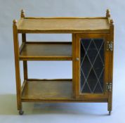 A vintage oak tea trolley. 72.5 cm long.