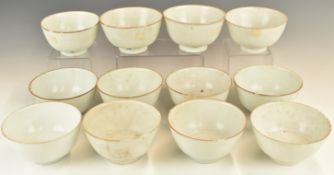 Twelve Chinese Kangxi period pedestal bowls with ivory / celadon glaze, from the Vung Tau Cargo,