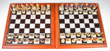 Two chess sets with fantasy Dungeons and Dragons style pieces, both with boards.