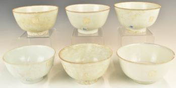 Six Chinese Kangxi period pedestal bowls with ivory / celadon glaze, from the Vung Tau Cargo, some