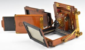 19th or early 20thC mahogany plate camera with shutter and lens, together with two film holders