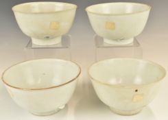 Four Chinese Kangxi period pedestal bowls with ivory / celadon glaze, from the Vung Tau Cargo,
