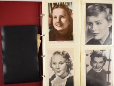 Album of postcards with mainly stars of stage and screen, some signed, includes Kirk Douglas, Hedy
