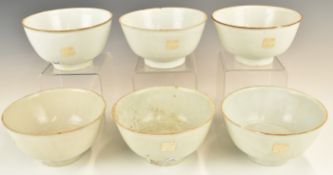 Six Chinese Kangxi period pedestal bowls with ivory / celadon glaze, from the Vung Tau Cargo, some