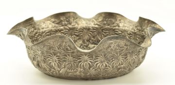 Burmese or Indian silver bowl with embossed decoration of various animals, length 14.5cm, weight