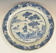 Chinese 19thC large blue and white charger decorated with lone figure on a shore, sailing boat,