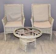 Two Bramblecrest reclining garden chairs and a circular table