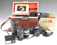 Canon A1 35mm SLR camera with 28mm 1:2.8 lens, together with Vivitar 135m 1:2.8 and Kiron 80-200mm
