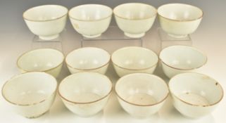 Twelve Chinese Kangxi period pedestal bowls with ivory / celadon glaze, from the Vung Tau Cargo,