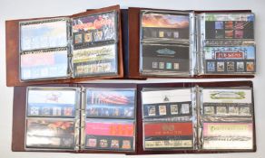 A collection of GB presentation packs in five folders, high face value