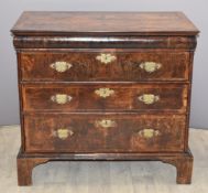 Queen Anne inlaid, quarter veneered walnut chest of three graduated drawers with cockspur detail,